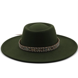 Close-up of a dark green wool fedora hat featuring an intricate woven decorative band