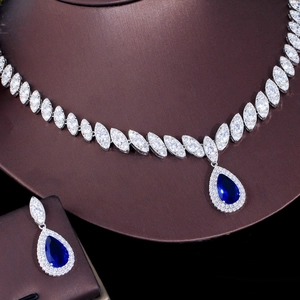 Luxury bridal jewelry set with pear-cut blue stones and marquise cubic zirconia
