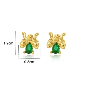 Detail of gold bee stud earrings with green zircon and size specs 1.2cm by 0.8cm