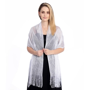 Detailed view of silver sparkling shawl with shimmering metallic fibers and elegant long tassels