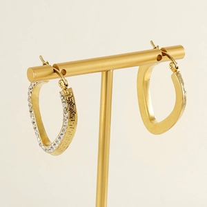 Gold-plated stainless steel hoop earrings with Greek key pattern and sparkling rhinestones