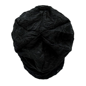 Detailed view of black slouchy beanie with textured double-layer pleated lace fabric