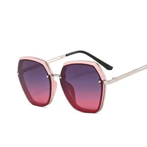 Fashionable geometric oversized sunglasses with pink metal frame and gradient lenses