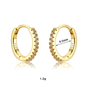 Macro shot of gold-plated lightning earrings with S925 stamp and 9.5mm diameter measurements