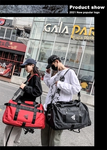 Detail showing red and black large capacity oxford travel bags with adjustable straps