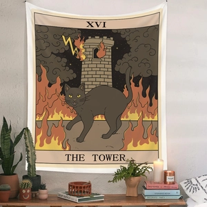 Detail view of The Tower tarot cat tapestry hanging on a white wall with home decor