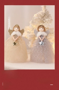 Close-up of golden and silver Christmas angel tree toppers with sequined mesh dresses