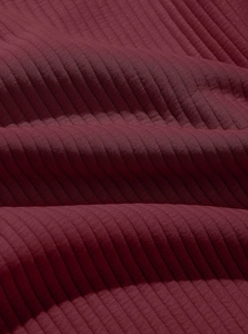 Detailed macro view of burgundy twill knit fabric texture on men's half-zip sweatshirt