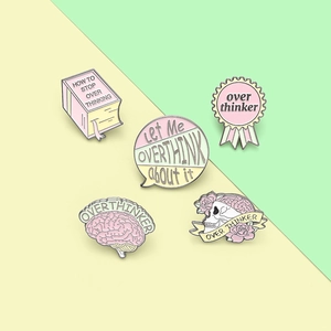 Detail view of 5-piece enamel pin set featuring skeleton and brain overthinking designs