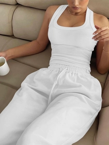 Close-up of white ribbed tank top and matching drawstring joggers for casual loungewear