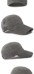 Detail view of dark grey sequined knit baseball cap showing texture and adjustable strap