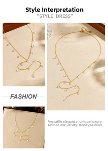Detailed macro view of gold-plated stainless steel chain with blue water drop pendants