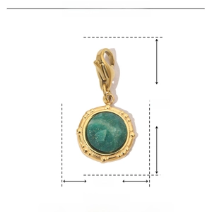 Macro detail of a 12mm green natural stone charm with golden stainless steel clasp
