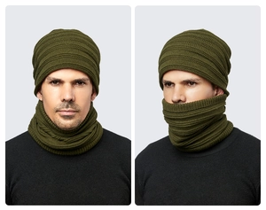 Detail of army green knitted beanie and neck gaiter set showing texture on model