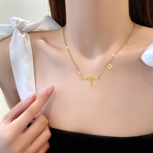 Minimalist heartbeat line necklace in gold titanium steel with hollow heart charm