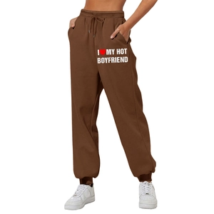 Women's brown high waisted joggers featuring heart slogan print and elastic drawstring waist
