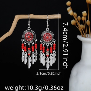 Detail view of Bohemian tassel earrings showing dimensions and red floral beadwork