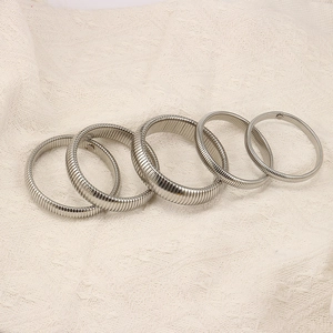 Set of five silver elastic stainless steel tubogas bracelets in various widths