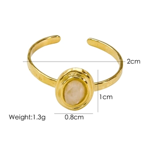 Detailed view of gold open ring with dimensions and pink oval natural stone inlay