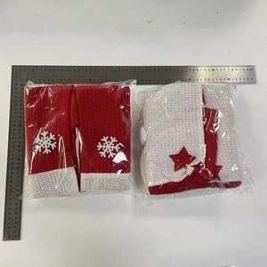 Detail showing red and white knitted Christmas chair leg covers with snowflake patterns
