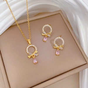 Titanium steel jewelry set with sparkling rhinestones, pink drop crystal and gold bow