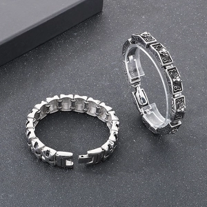Close-up of retro silver wolf-head chain bracelet with dragon motif and relief details