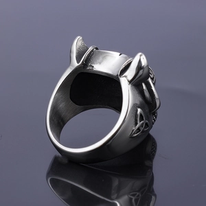 Detail of vintage stainless steel wolf ring with celtic triquetra knot engraving