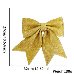 Detailed view of a golden glitter Christmas bow with 27cm by 32cm size specifications