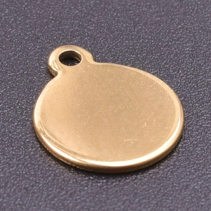 Close-up of 18k gold plated stainless steel round disc pendant with small hanging loop