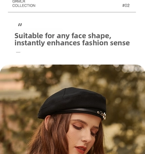 Detail of a vintage black beret featuring a delicate leather strap and gold metal buckle
