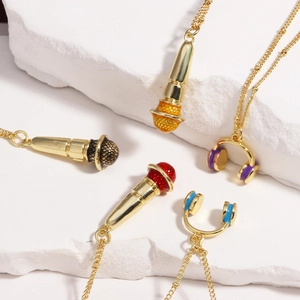 Hip-hop microphone and headphone pendants on gold chains for music fans and trendsetters
