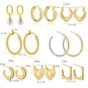 Collection of gold minimalist stainless steel earrings including hoop and stud styles