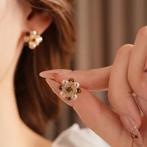 Vintage floral pearl earrings with tiger eye stone and zircons on a gold-plated stud