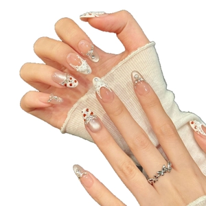 Handmade press-on nails with champagne pearl cat-eye finish and white lace designs