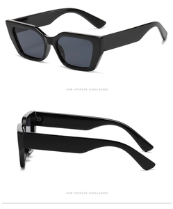 Detailansicht der markanten schwarzen quadratischen Sonnenbrille mit dicken Bügeln und Gläsern