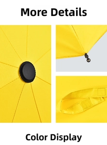 Detail view showing the yellow umbrella top, rounded beads, and velcro strap