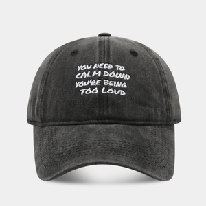 Detailed embroidery of slogan on dark grey washed cotton vintage baseball cap