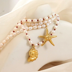 Starfish and conch pendant necklace with white freshwater pearls and red beads accents