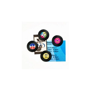 Set of four retro vinyl record fridge magnets featuring colorful vintage music labels