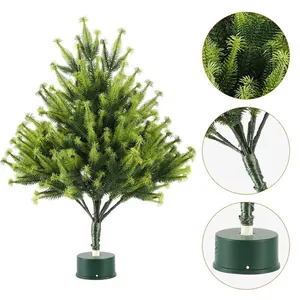 Miniature flocked Christmas tree with realistic pine needles and stable green base
