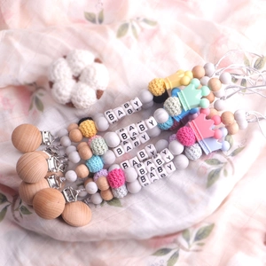 Handmade beechwood and silicone baby pacifier clips with crochet beads and crown detail