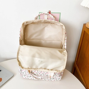 Interior view showing the large capacity and laptop compartment of the floral backpack