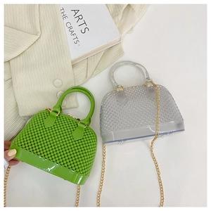 Detail of green and gray PVC jelly shell bags with bubble texture and gold chains