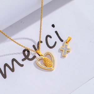 Detail of gold-plated hollow heart pendant with Virgin Mary and cross charm necklace