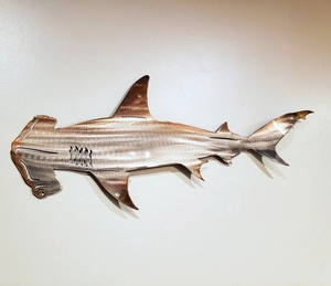 Detailed close-up of hammerhead shark wall art crafted in heat-treated polished metal