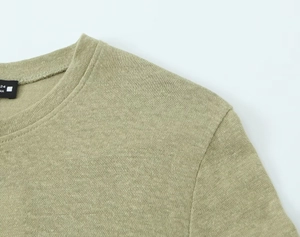 Close-up of the fine knit texture and neckline detailing on this olive green linen blend t-shirt