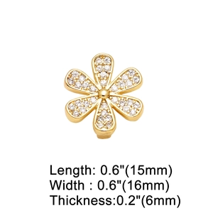Macro detail of 18K gold plated floral charm with sparkling cubic zirconia stones 15x16mm