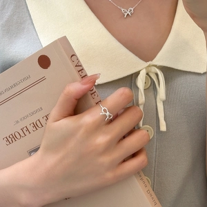 Elegant S925 sterling silver bow jewelry set with hollow twisted ring and necklace for women