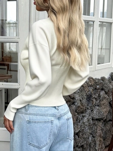 Slim fit white knit sweater with long sleeves and back detail for a casual chic look