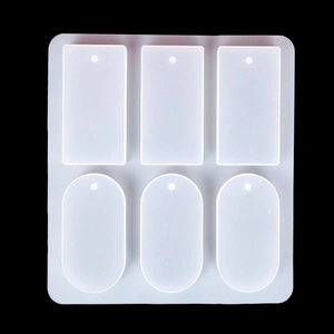Macro view of 6-cavity silicone resin mold with rectangular and oval soap tray shapes